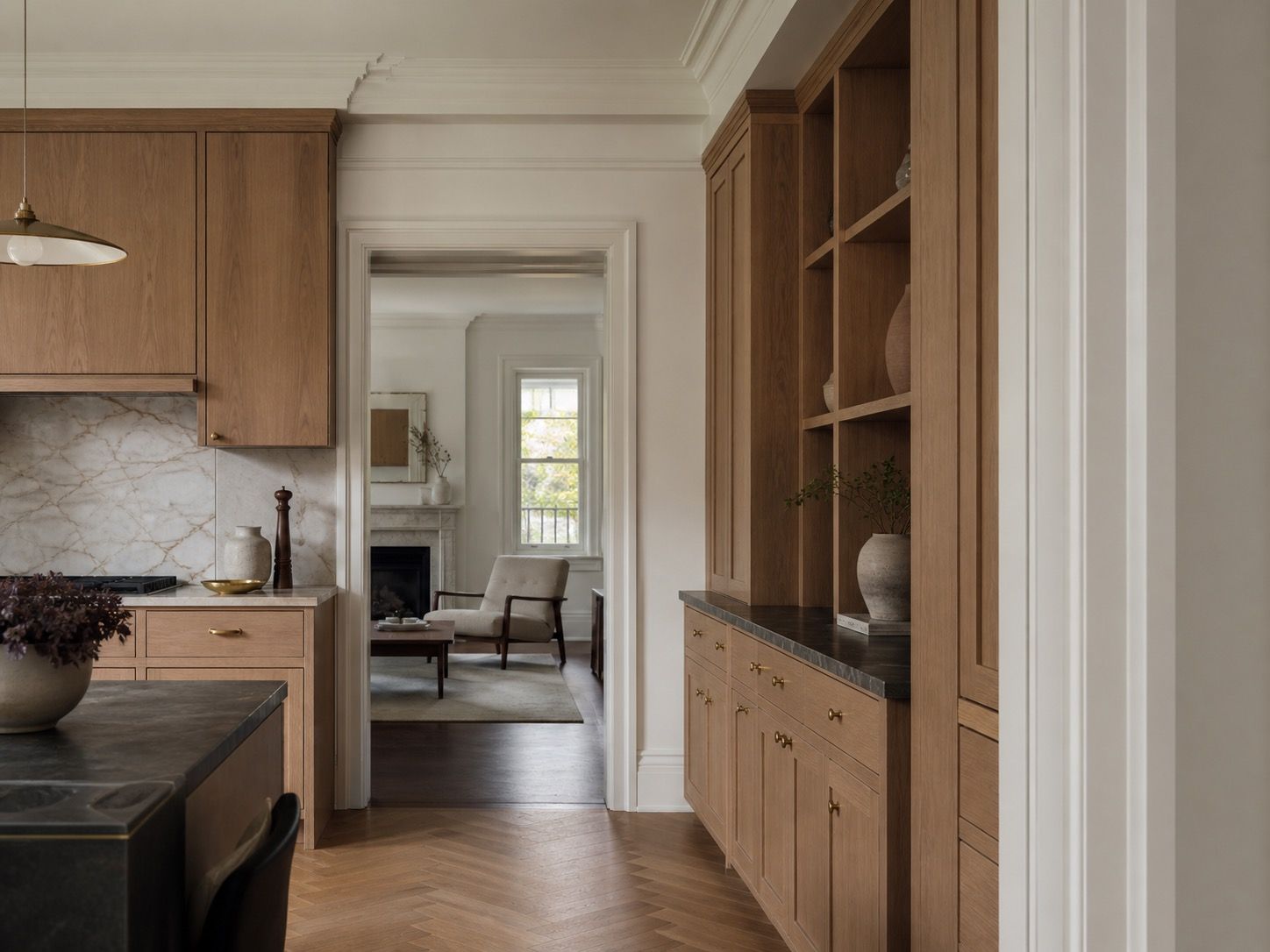 Finished home interior with custom wood cabinetry, period trim, and warm natural materials