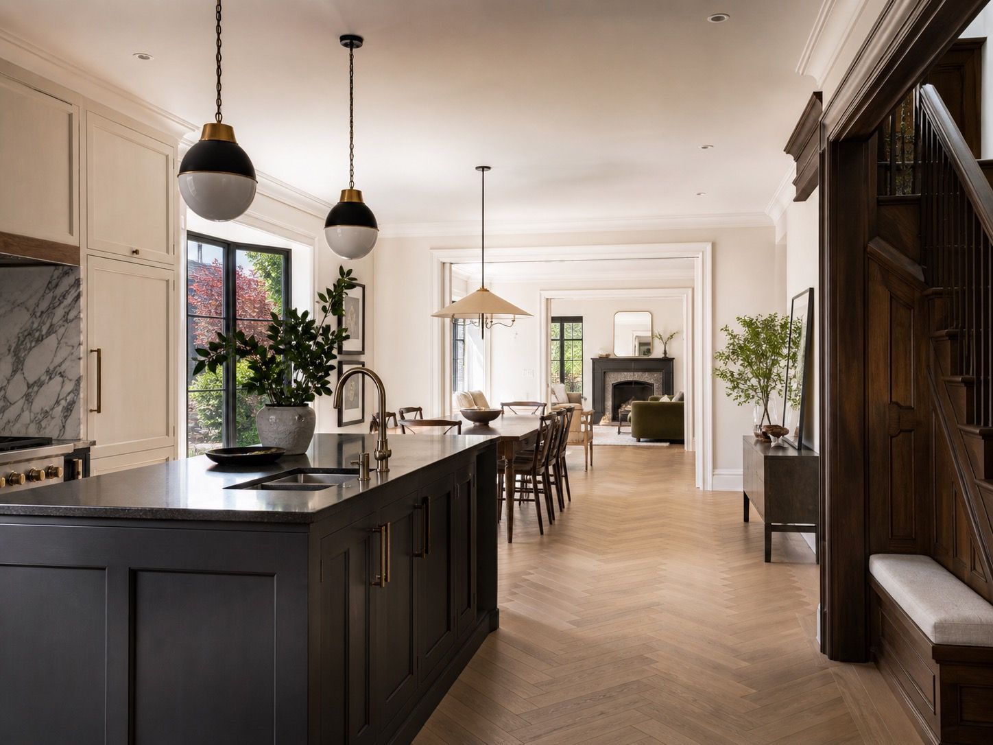 Connected kitchen and dining area with stone and timber finishes